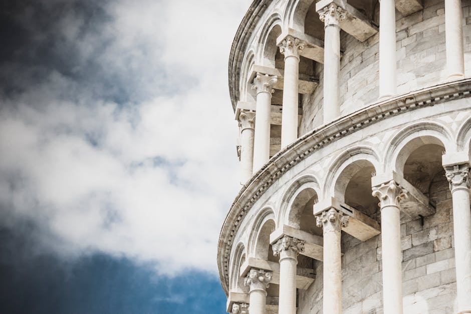 Close-up of the iconic Leaning Tower of Pisa showcasing its architectural details and columns.