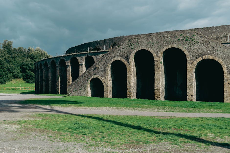 Explore the stunning vistas of ancient Pompeii's amphitheater. Discover historic ruins in vibrant sunlight.